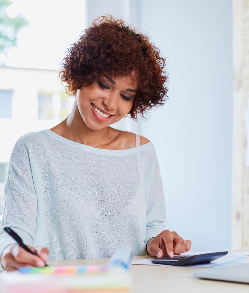 The woman is happy with her finances